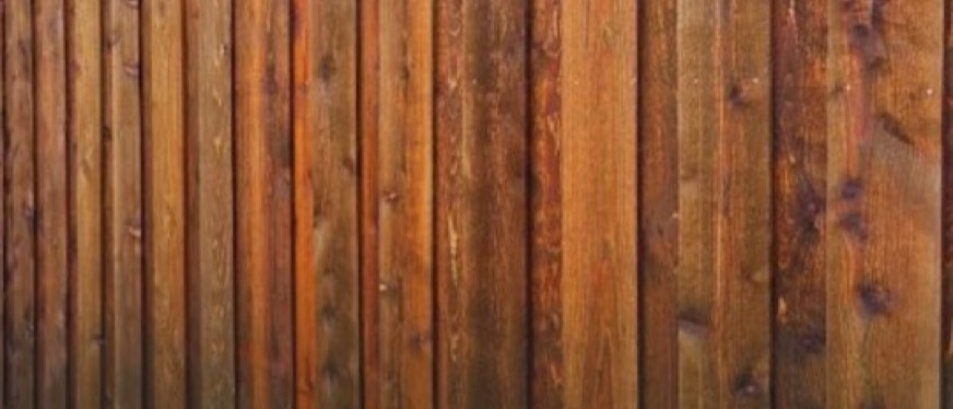 8 foot cedar privacy fence along a walkway