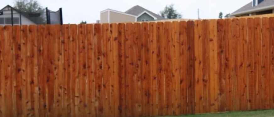 Stained cedar privacy fence built by Prestige Fence